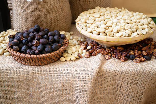 Coffee beans showing various stages of roasting from raw, stock photo