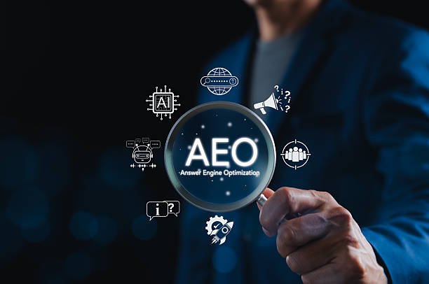 istock AEO Answer Engine Optimization Strategy Concept. Businessman holding magnifying glass with AEO icons, representing artificial intelligence, chatbots, search optimization, and marketing strategy. 2229241840