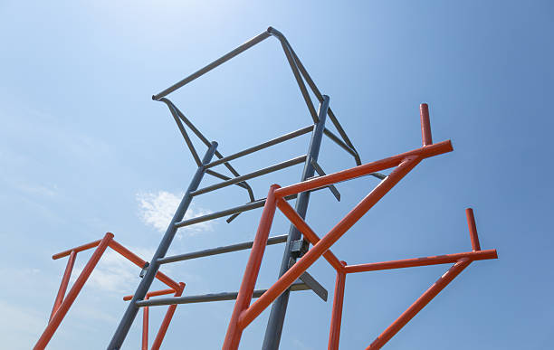 istock Colorful climbing structure attracts children to play while under a clear blue sky on a beautiful sunny day in a public park 2229241907