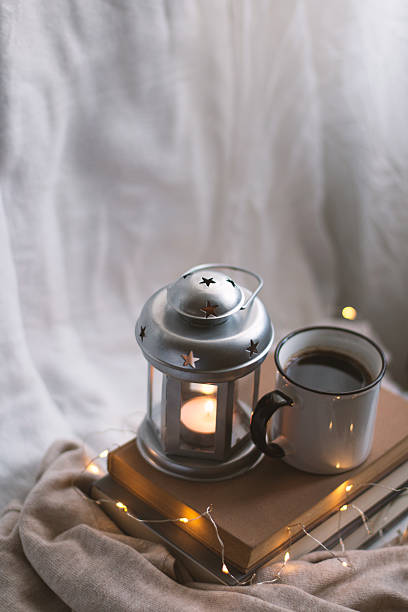 istock Cozy indoor relaxation with coffee, good books and candle. 2229246841