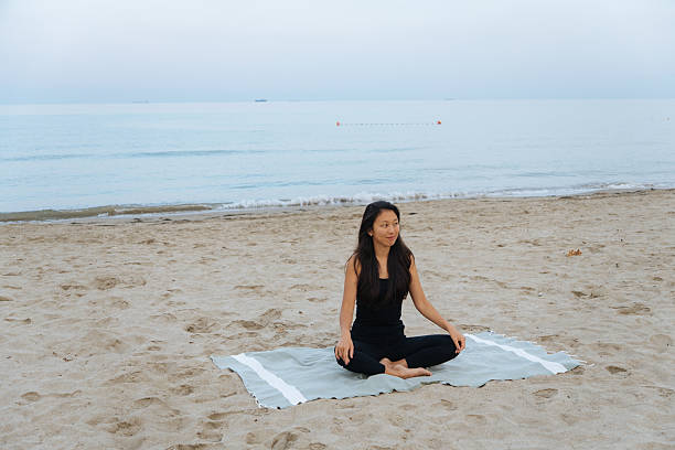 istock Yoga on the beach 2229248981