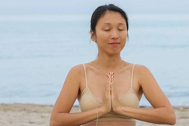 istock Yoga on the beach 2229249332