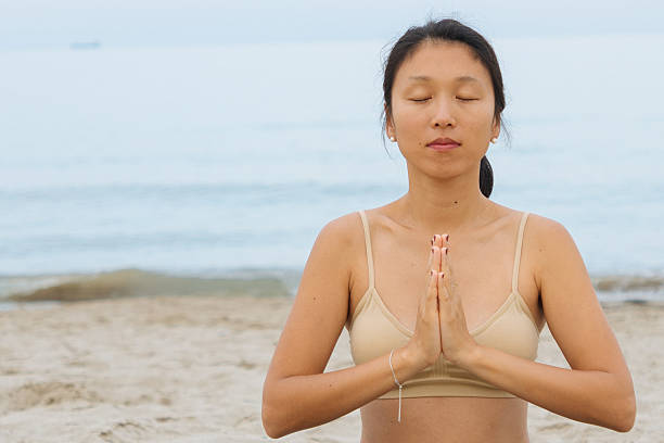 istock Yoga on the beach 2229249418