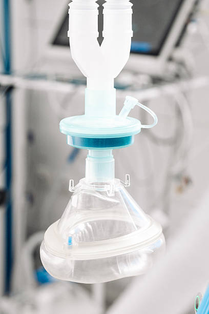 istock Medical equipment in a modern operating room, featuring anesthesia machine with breathing apparatus, monitors 2229250944