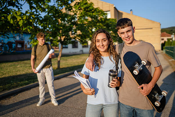 istock Smiling students walking home after school in the afternoon 2229251595