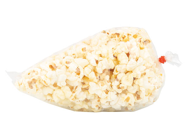 istock Popcorn in a Plastic Bag Tied with a Rubber Band on White Background 2229254465