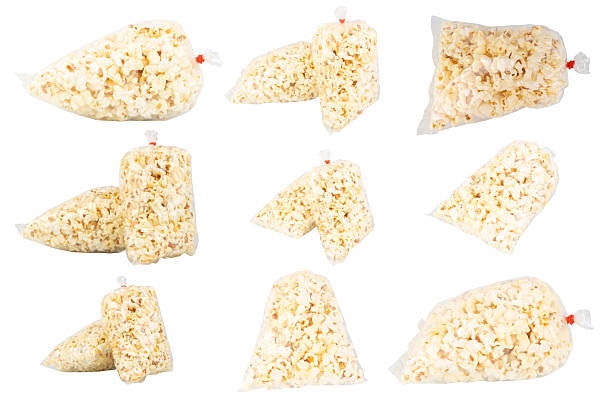 istock Popcorn in a Plastic Bag Tied with a Rubber Band on White Background 2229254469