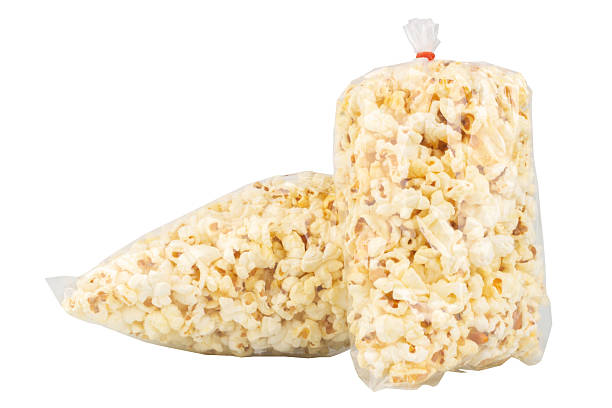 istock Popcorn in a Plastic Bag Tied with a Rubber Band on White Background 2229254479