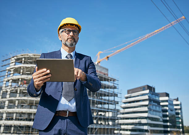 istock businessman construction site business architect building engineer builder tablet helmet architecture blueprint worker man contractor adult engineering industry 2229256676