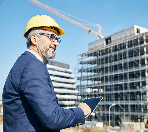 istock businessman construction site business architect building engineer builder tablet helmet architecture blueprint worker man contractor adult engineering industry 2229256872