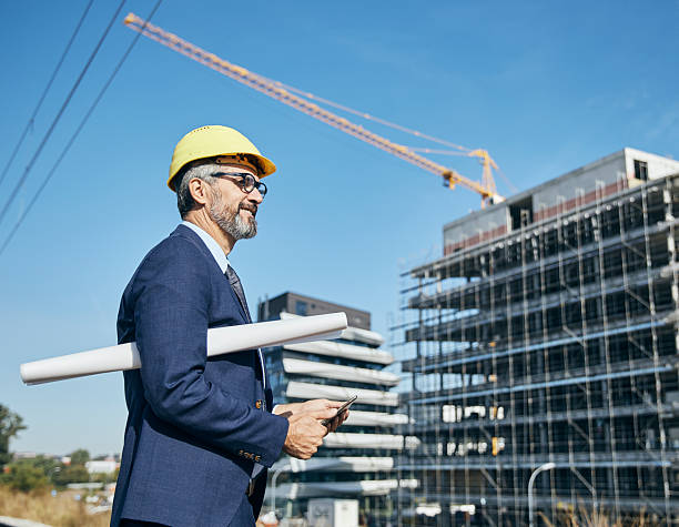 istock senior businessman architect helmet construction site building architecture tablet computer protective workwear blueprint plan 2229256942