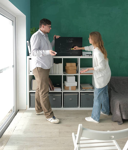 istock millennial man and woman working in small office, practicing a speech 2229259512