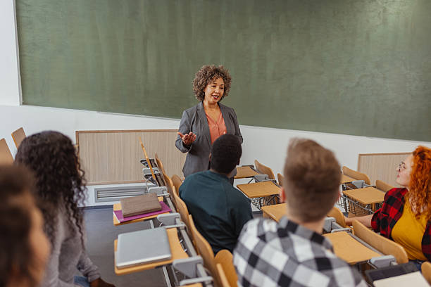 istock Mixed Race Female Lecturer Engaging With Students in Lecture Hall 2229260041