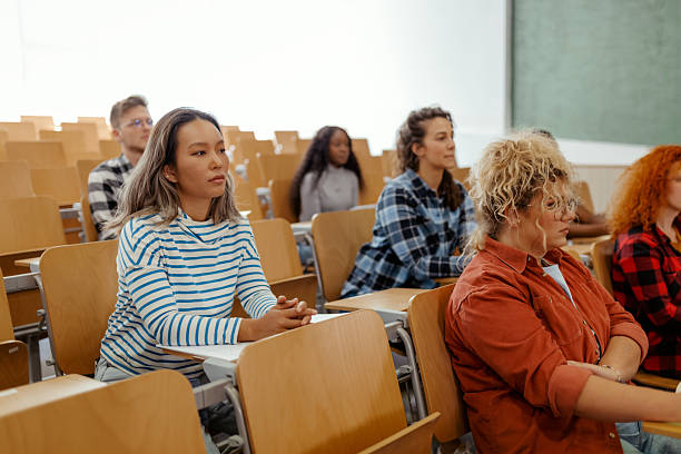 istock Focused College Student Listening Attentively in University Classroom 2229260215