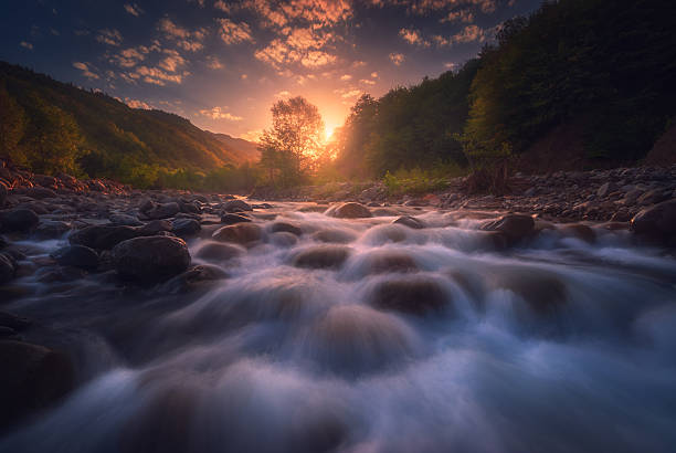istock Magical sunrise over fast flowing mountain river 2229263096