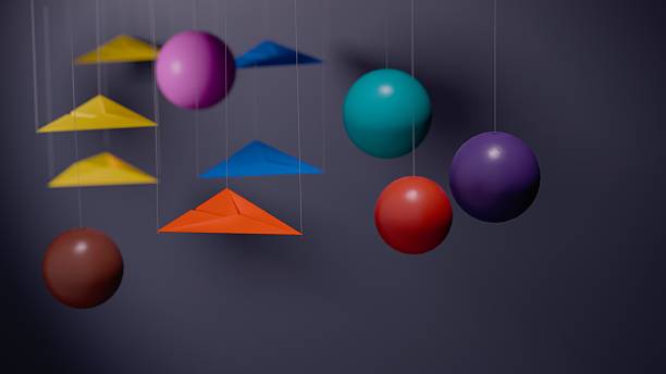 istock Paper airplanes and colorful spheres on dark background 2229266467