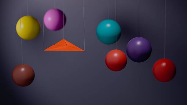 istock Paper airplanes and colorful spheres on dark background 2229266468