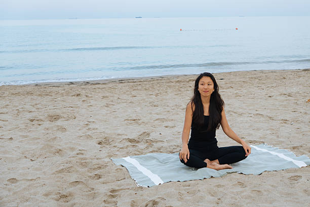 istock Yoga on the beach 2229269647