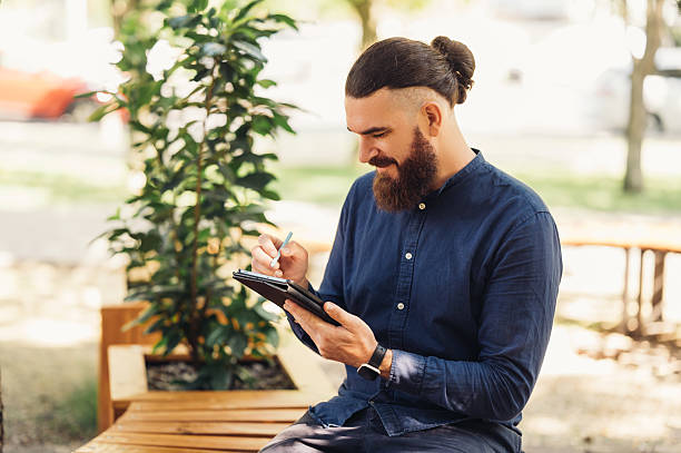 istock A Creative Professional is Engaged in Work on a Tablet While Surrounded by Natures Beauty 2229275067
