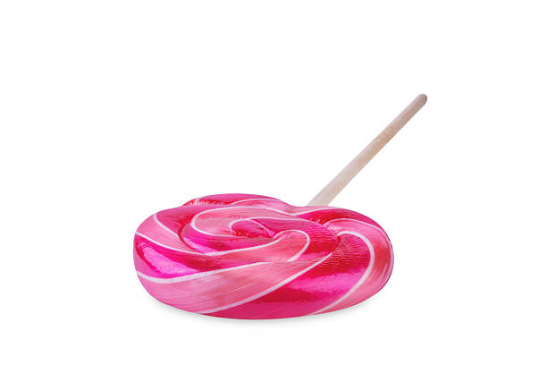 istock Pink spiral candy caramel lollypop on a white isolated background 2229283948