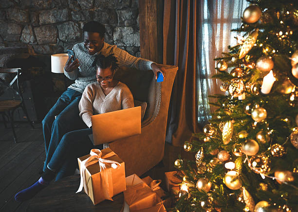 istock Young couple doing christmas shopping online 2229284372