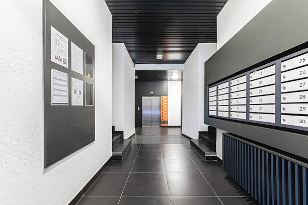 istock Modern apartment building hallway featuring mailboxes and elevator access in a contemporary design 2229285777