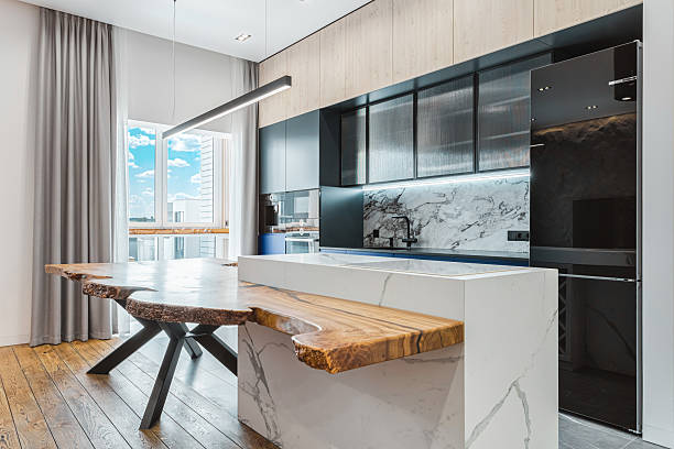 istock Modern kitchen with elegant wood and marble features in a bright urban apartment 2229286053