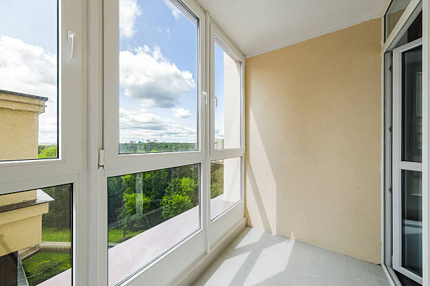 istock Bright and airy balcony view overlooking greenery and blue sky with clouds in a tranquil residential setting 2229286180