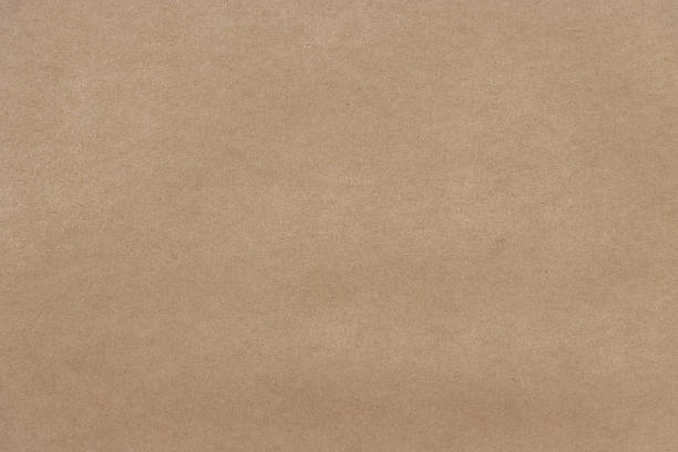 Brown recycled fiber paper or cardboard texture