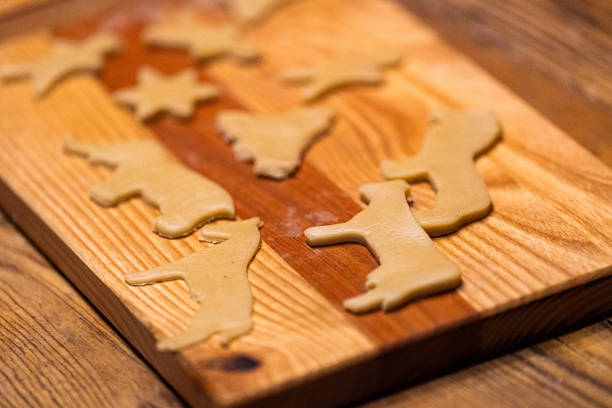 istock Raw Christmas Cookies on Wooden Cutting Board 2229291765