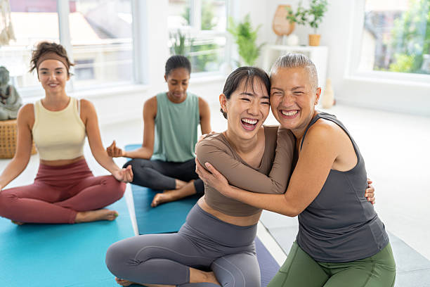 istock Four female friends bonding at a yoga studio during a relaxation session 2229296433