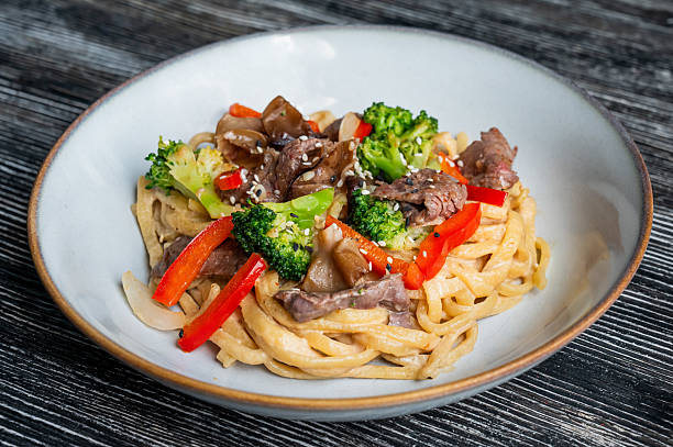 istock Top view of pasta with beef and broccoli. 2229298803