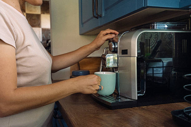 istock Making Coffee At Home. Electricity Use In Everyday Life 2229299317