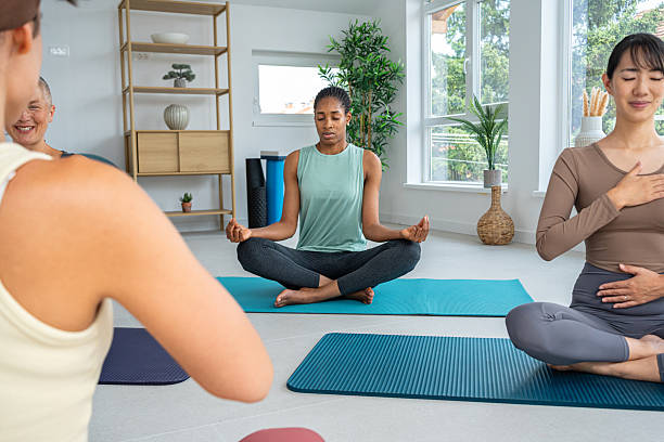 istock Diverse Group of Women Practicing Yoga in a Peaceful Studio Setting 2229300150