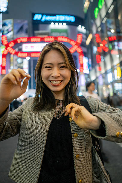 istock Happy young woman visiting downtown after work 2229304808