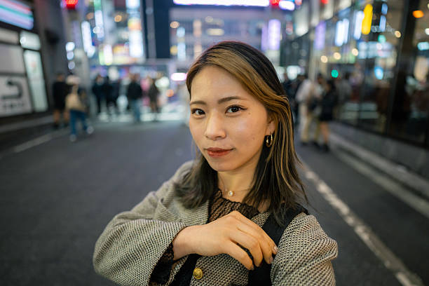 istock Young woman taking selfie picture in downtown district after work - smiling 2229304851