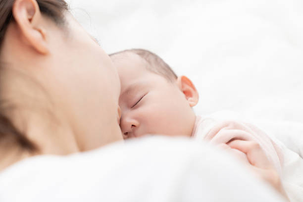 istock asian mother and baby 2229309181