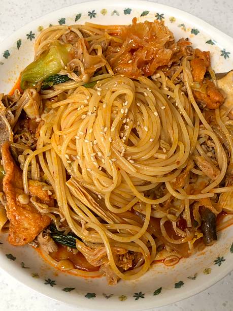 istock Spaghetti salad combines al dente pasta with fresh vegetables, tangy dressing, and optional herbs or cheese. A vibrant, refreshing dish perfect for light meals or gatherings. 2229313778