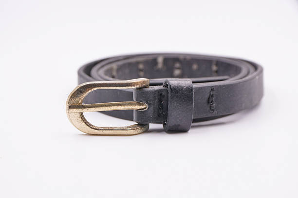 istock Old black belt with a golden buckle 2229318893