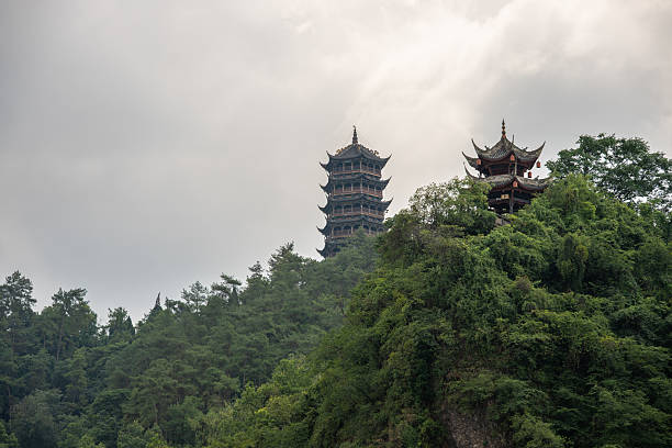 istock Traditional Pagoda Towers Surrounded by Lush Greenery on a Cliff 2229319787