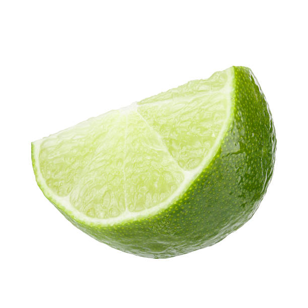 istock Green lime cut in half isolated on a white background 2229322665