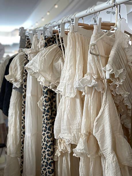 istock Clothing rack with a selection of flowy, patterned garments in light and soft fabrics 2229325332