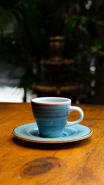 istock Relaxing coffee break in a peaceful garden setting with a blue coffee cup 2229327662