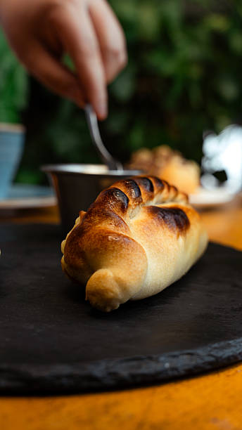istock Freshly baked empanada served on a black slate plate 2229327893