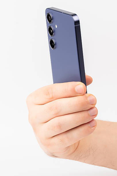 istock Hand hold blue modern smartphone close up view 2229328983