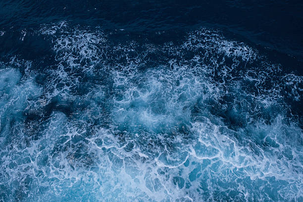istock Blue sea texture with waves and foam 2229336024