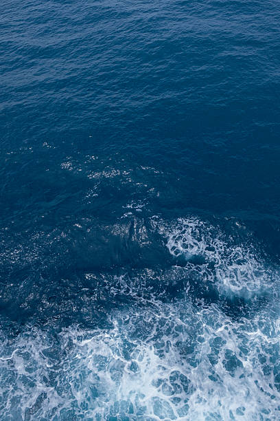 istock Blue sea texture with waves and foam 2229336251
