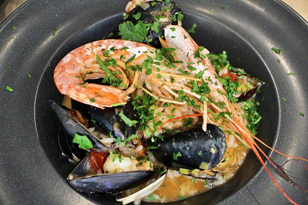 istock Italian cuisine: seafood risotto in Valletta, Malta 2229337927