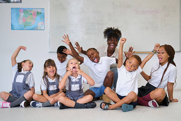 grimacing school children with fun