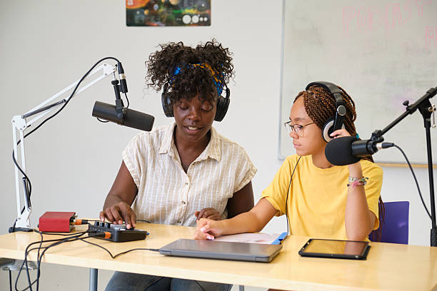 istock Two female podcasters recording audio content in a studio 2229344174